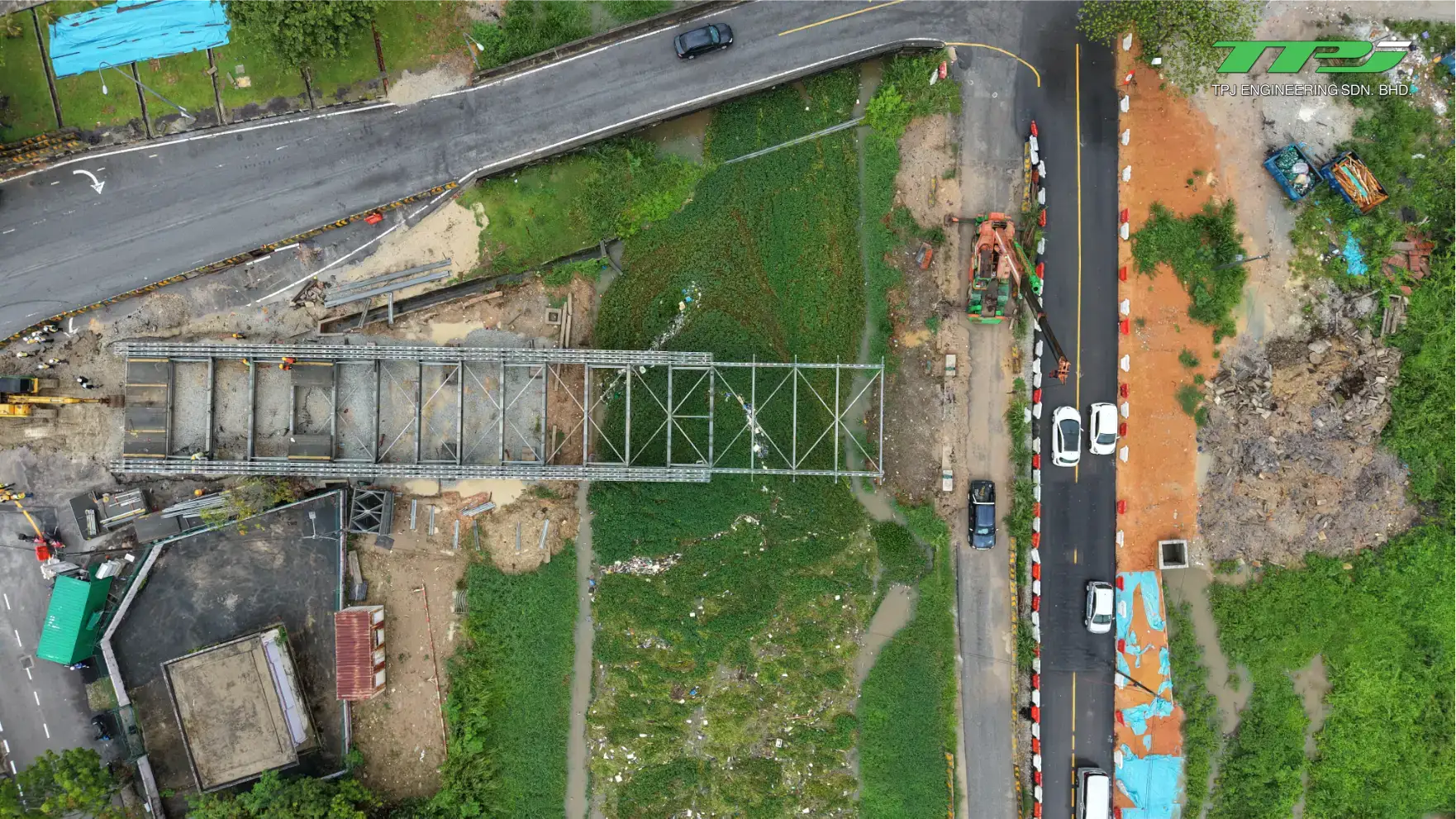 Aerial view of the Carrefour Bridge construction site and temporary Bailey bridge beside the road in Seberang Jaya, Penang.