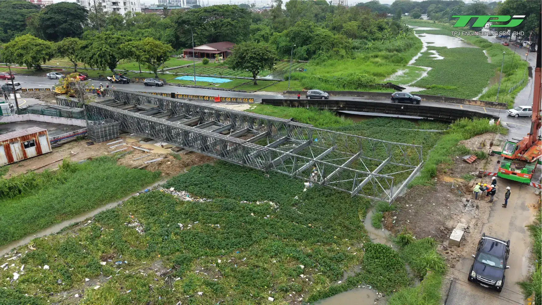 Aerial view of Bailey bridge truss installation beside the existing road crossing at the Carrefour Bridge site in Seberang Jaya.