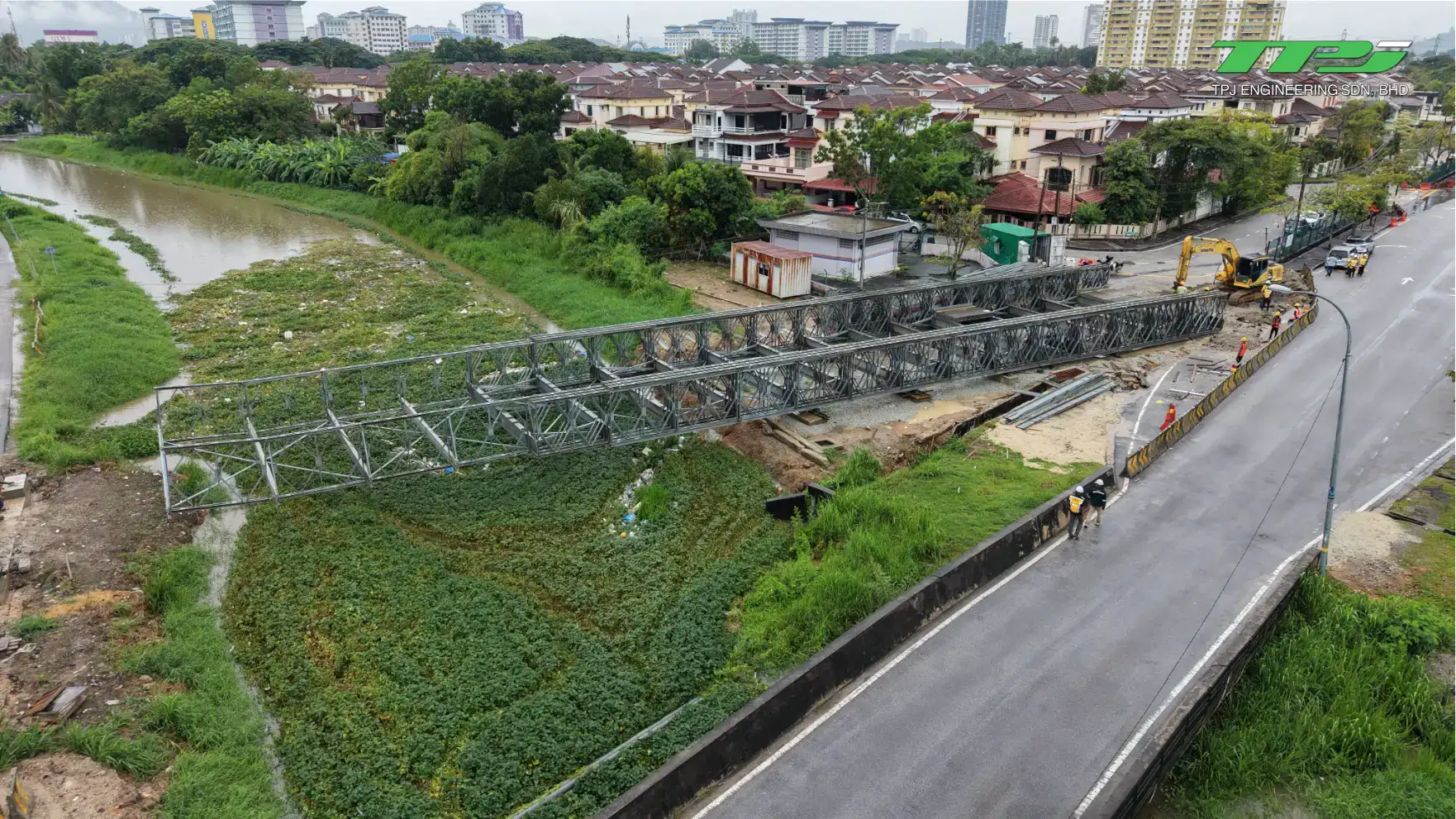 Aerial view of the temporary Bailey bridge alignment beside the completed road approach at Carrefour, Seberang Jaya.