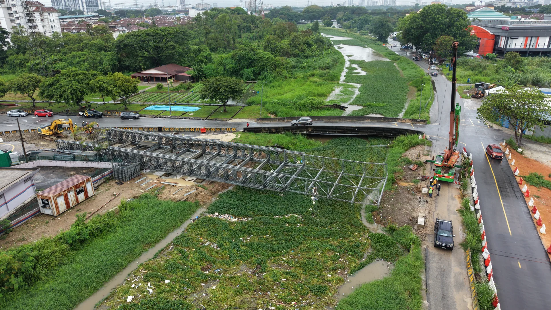 Aerial view of Stage 1 Bailey bridge installation beside the existing Carrefour crossing in Seberang Jaya, Penang.