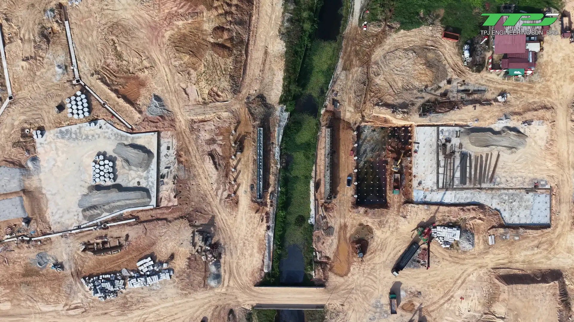 Overhead view of Sungai Binjai and foundation works on both banks at the Batu Kawan bridge site, Penang.