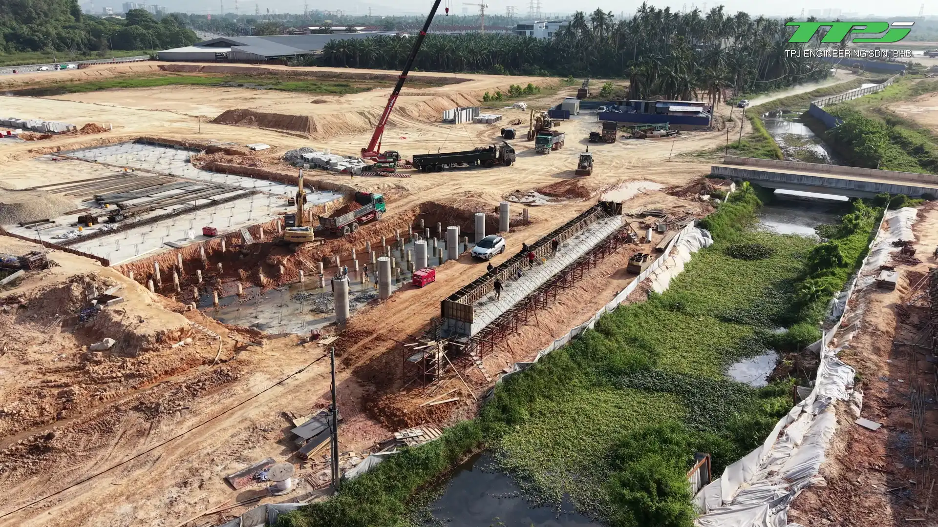 Bridge supports, reinforcement and formwork along Sungai Binjai at the Batu Kawan construction site.