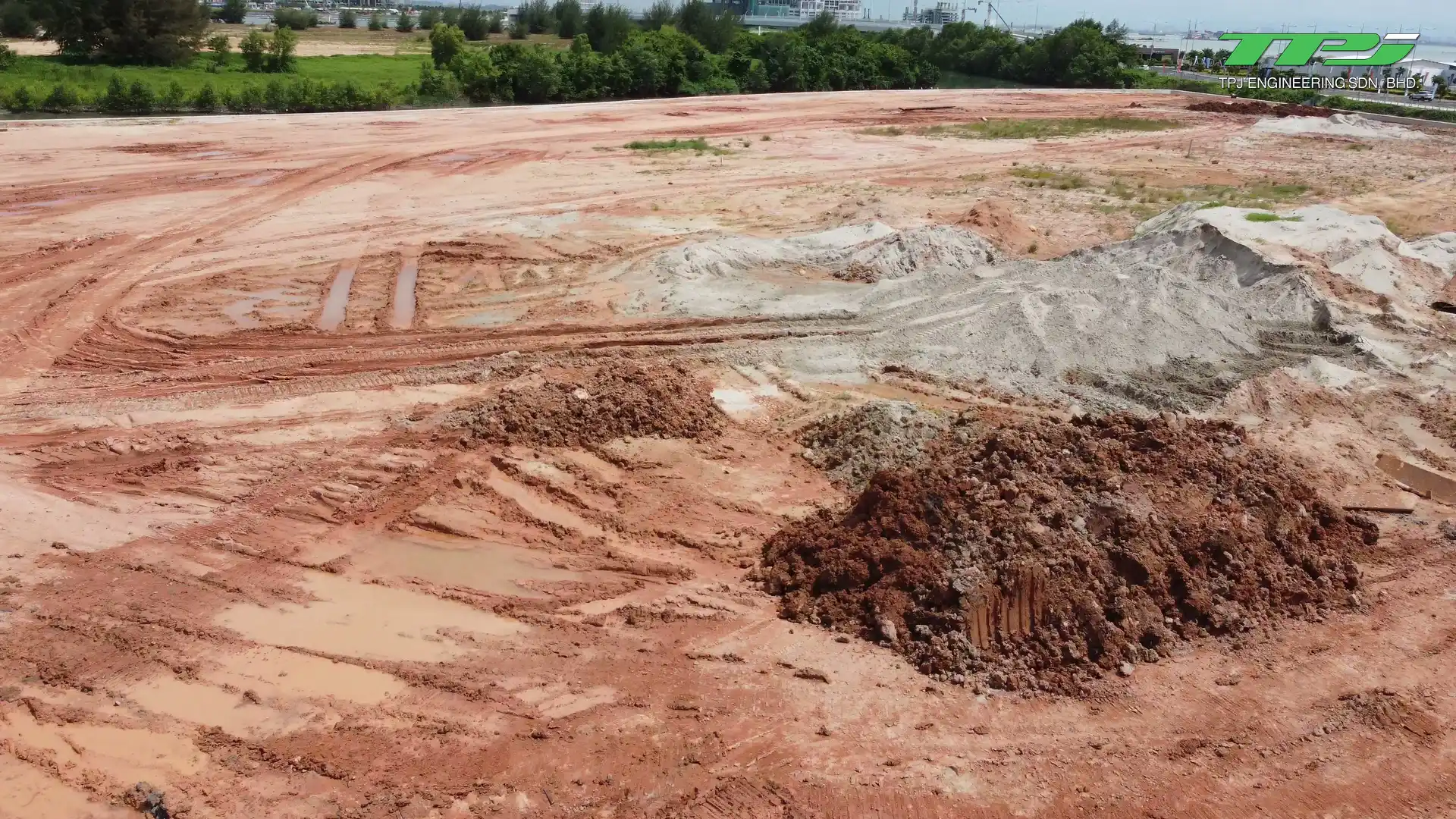 Sand and soil stockpiles across the Water Body A reclamation work area