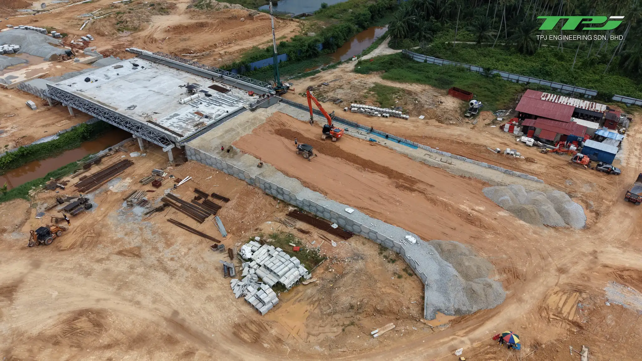 Aerial view of the Batu Kawan bridge and approach embankments retained by concrete panel walls.
